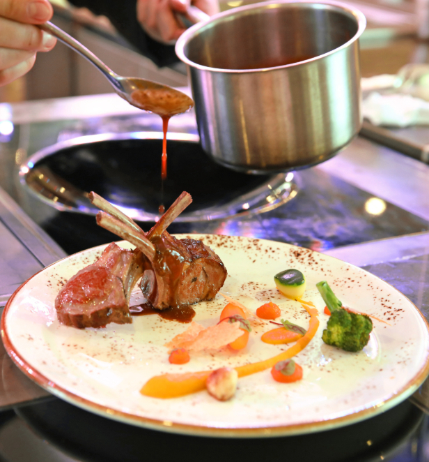 A culinary expert crafts a sophisticated dish on a luxurious plate, emphasizing the elegance of fine dining and flavors.