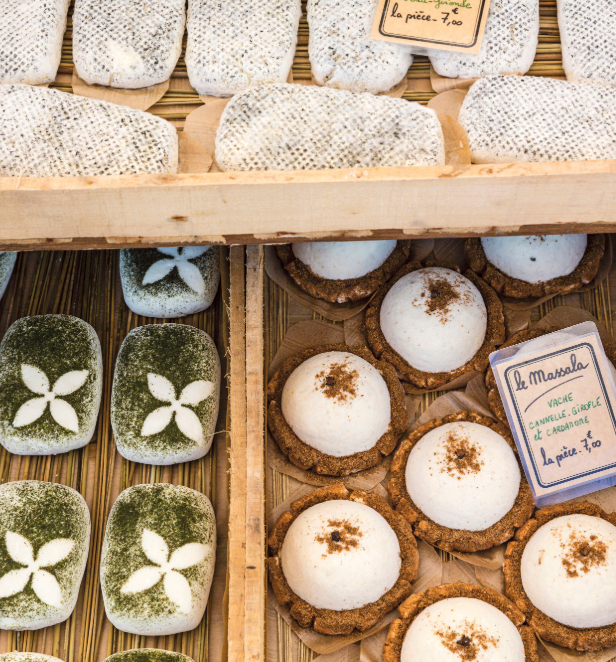 A tempting selection of pastries, featuring different flavors and textures, beautifully presented on a wooden serving platter.