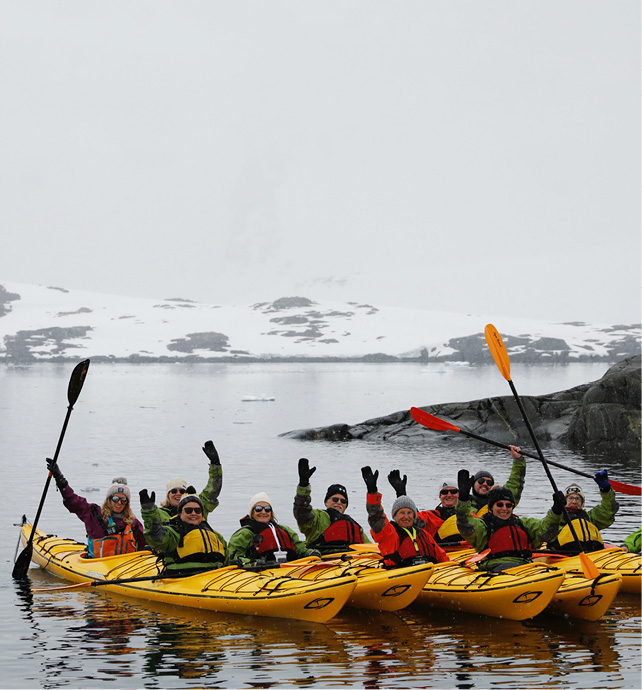 Group of people in yellow sea kayaks
