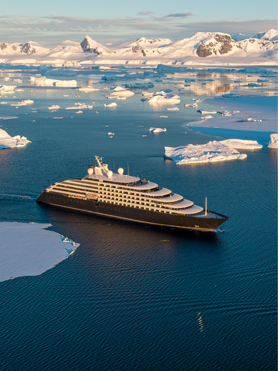 Ultra-luxury discovery yacht sailing through the waters of Antarctica