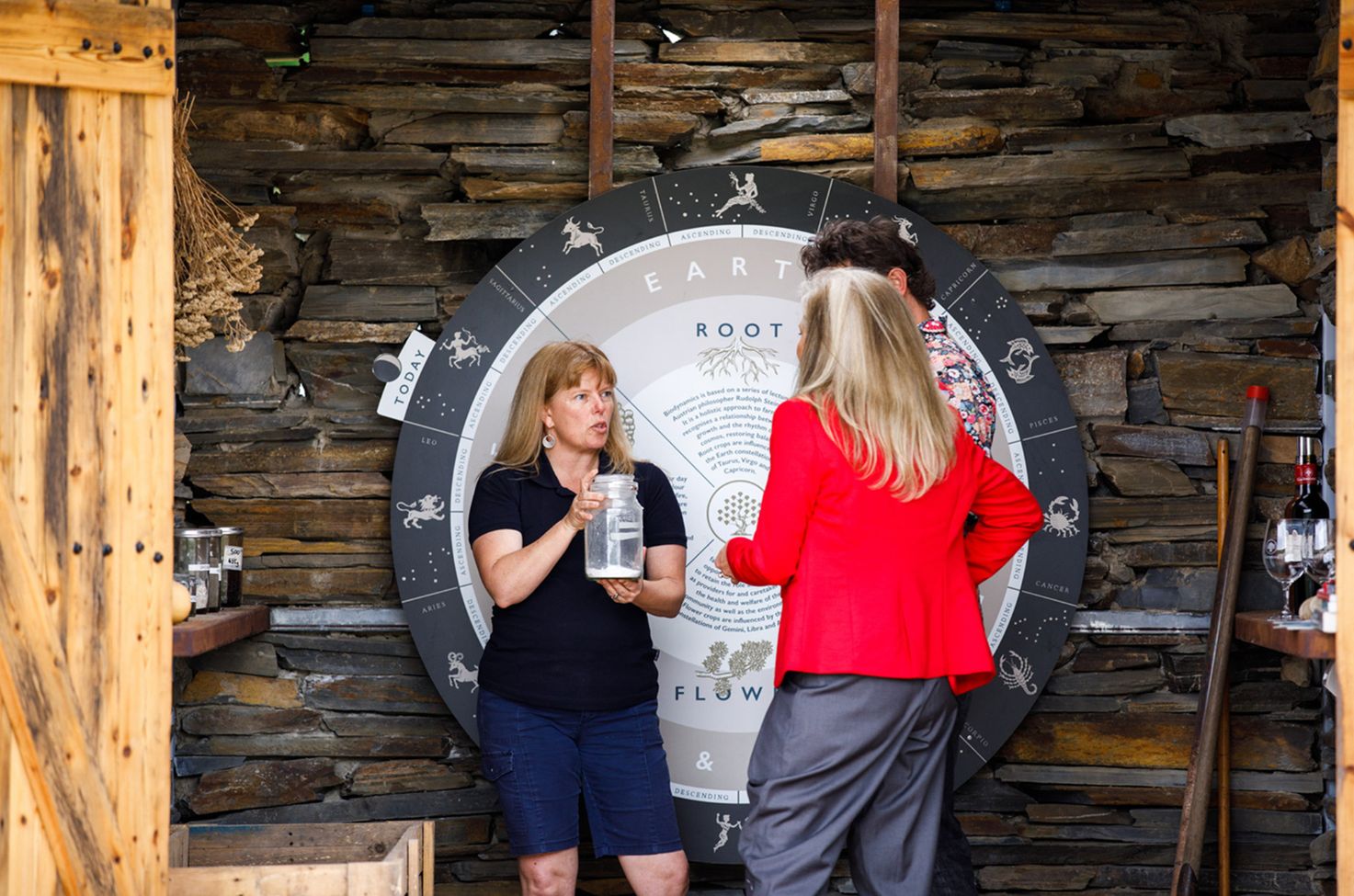 Two people listening to a tour director at Gemtree Wines